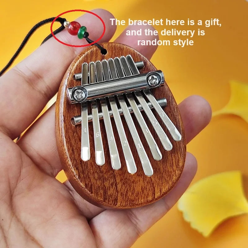 1 unidad de mini piano de pulgar de madera, juguetes musicales, 8 tonos, piano de dedo portátil para principiantes