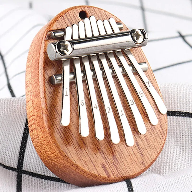 1 unidad de mini piano de pulgar de madera, juguetes musicales, 8 tonos, piano de dedo portátil para principiantes